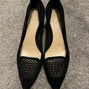 Black suede block heel shoes.